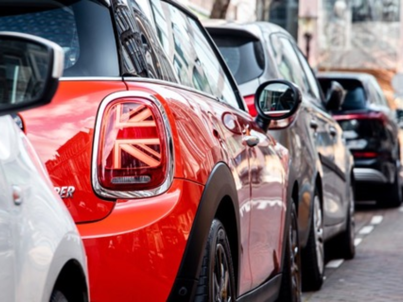 Cars parked in a row. 