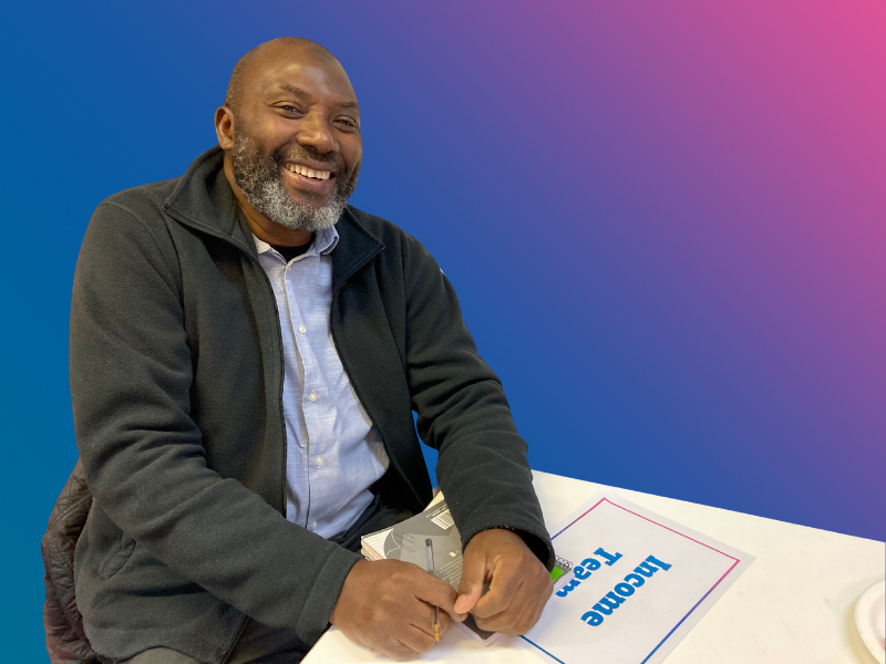 ISHA's Income Manager smiling. 