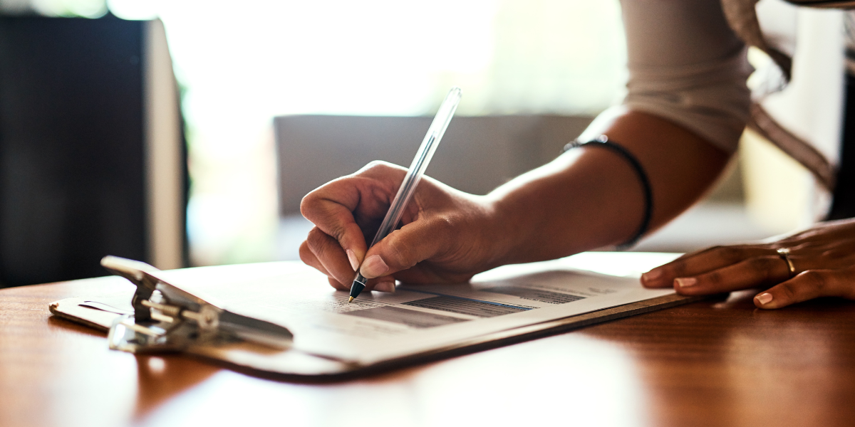 A woman reads a document. 
